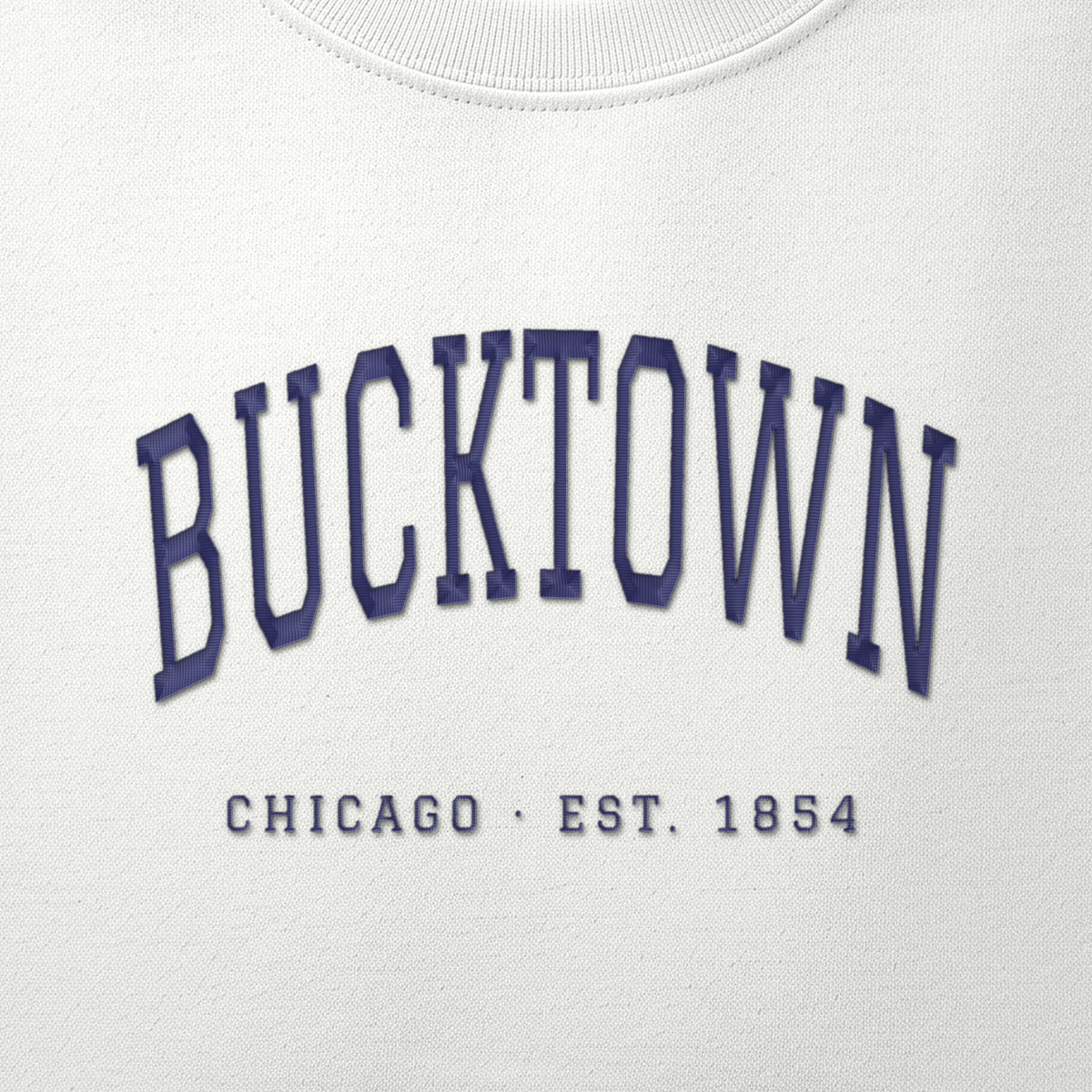 Close-up of navy satin-stitch Bucktown embroidery