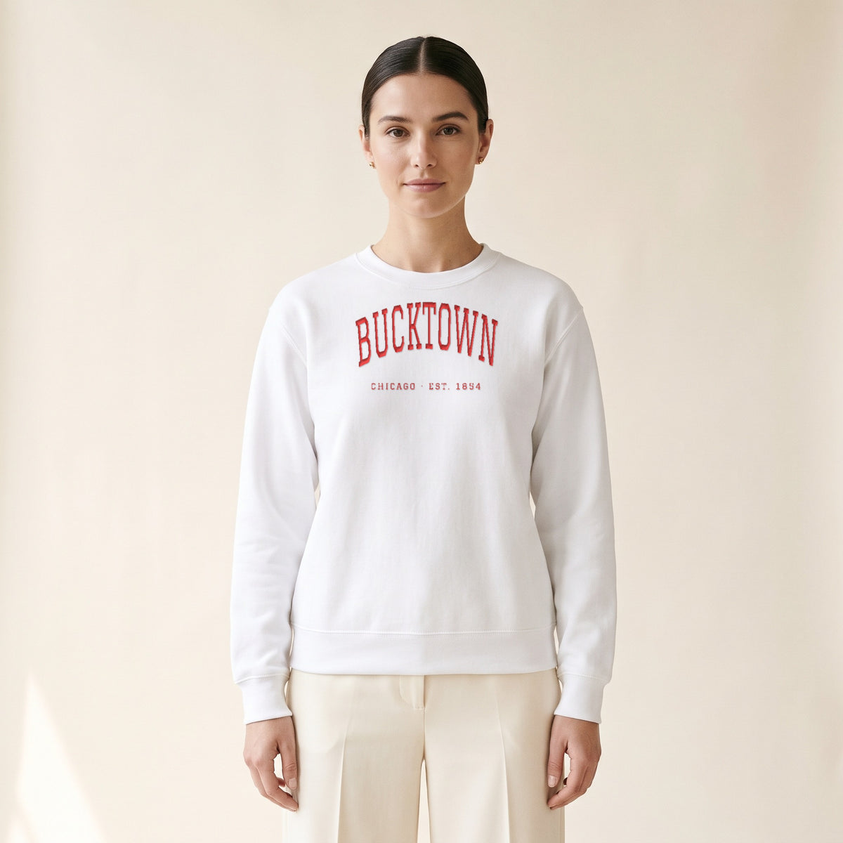 Model wearing the Bucktown Chicago Embroidered Crewneck — Red Thread in White