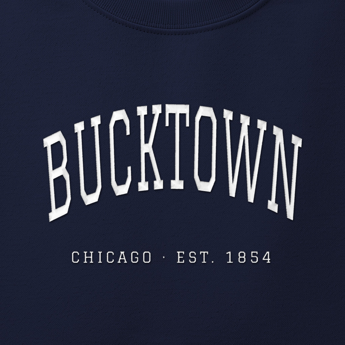 Close-up of white satin-stitch Bucktown embroidery
