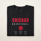 Chicago Basketball 91-98 crewneck, Black, folded on ivory