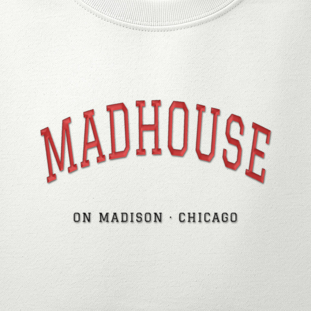 Close-up of the red & black satin-stitch Madhouse on Madison embroidery