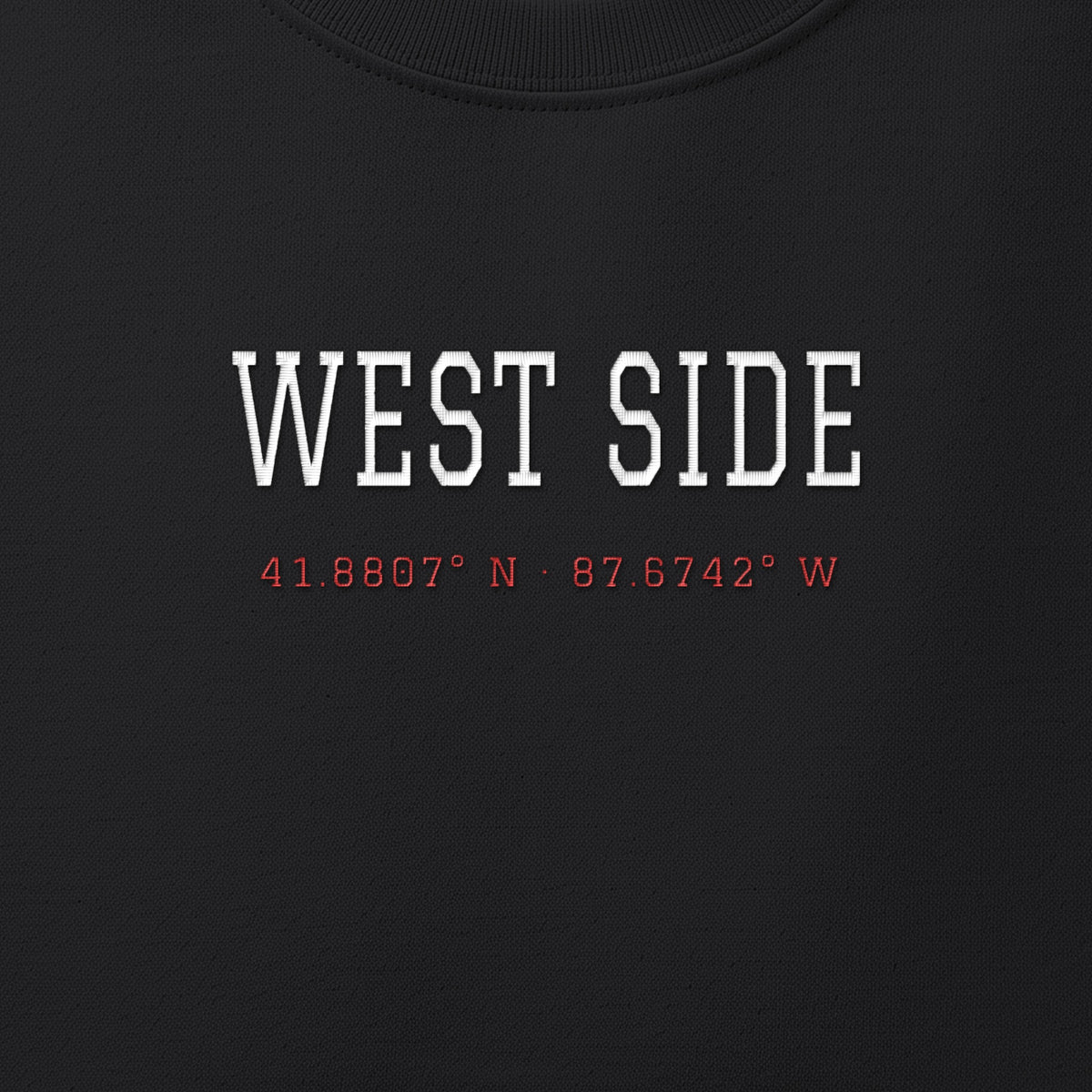 Close-up of the white & red satin-stitch West Side Coordinates embroidery