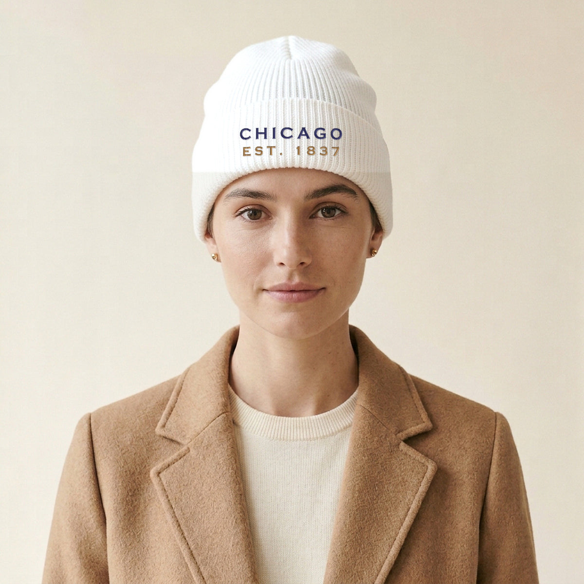 Model wearing the Chicago Est. 1837 Embroidered Cuffed Beanie, Navy Thread in White