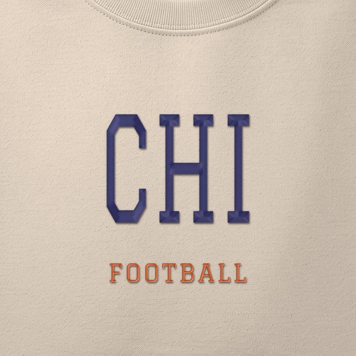 Close-up of the navy & orange satin-stitch CHI embroidery