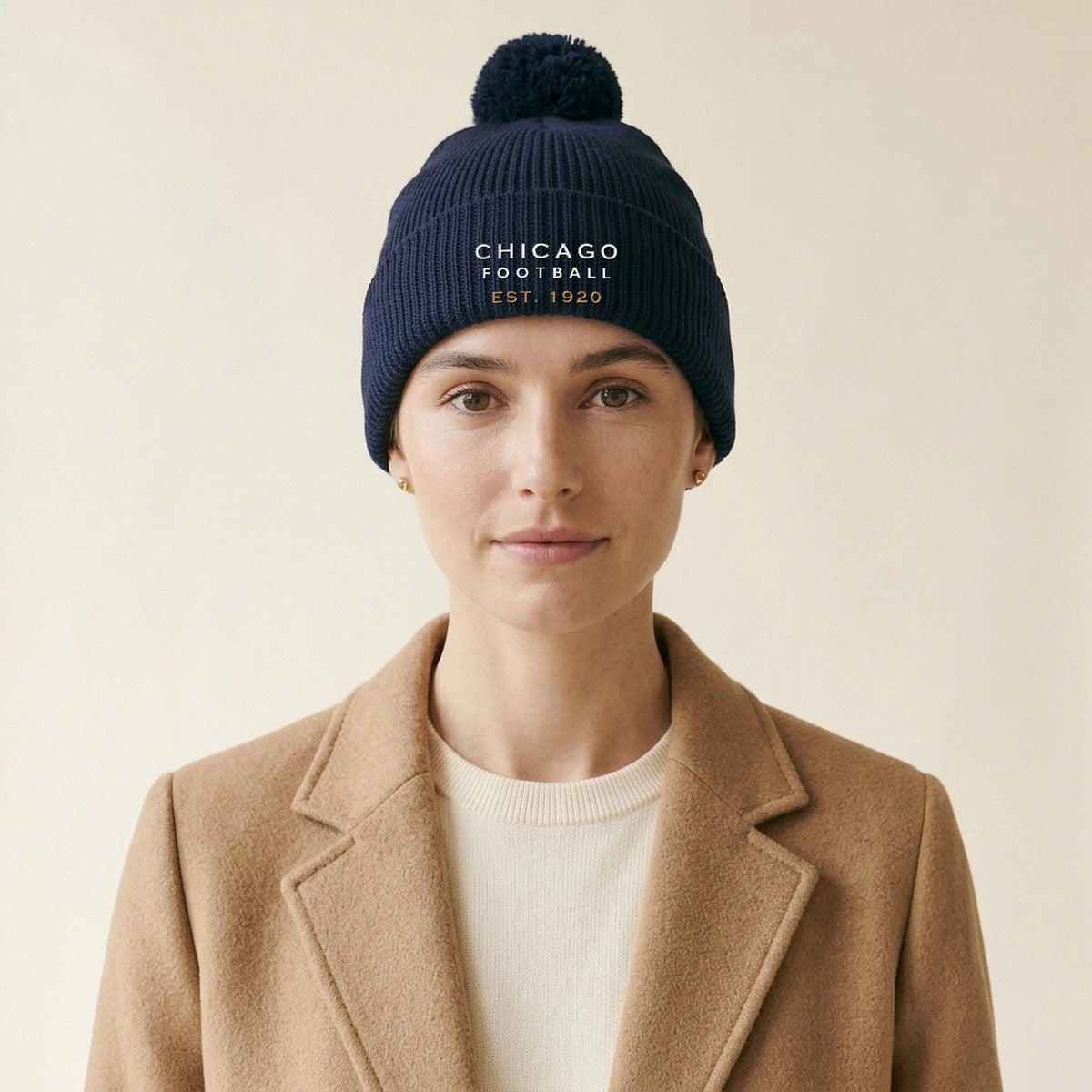 Model wearing the Chicago Football Est. 1920 Embroidered Pom-Pom Beanie in Navy
