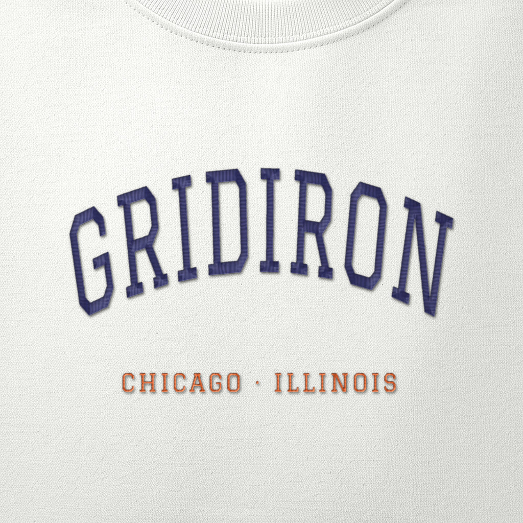 Close-up of the navy & orange satin-stitch Gridiron embroidery