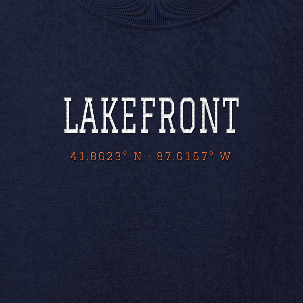 Close-up of the white & orange satin-stitch Lakefront Coordinates embroidery