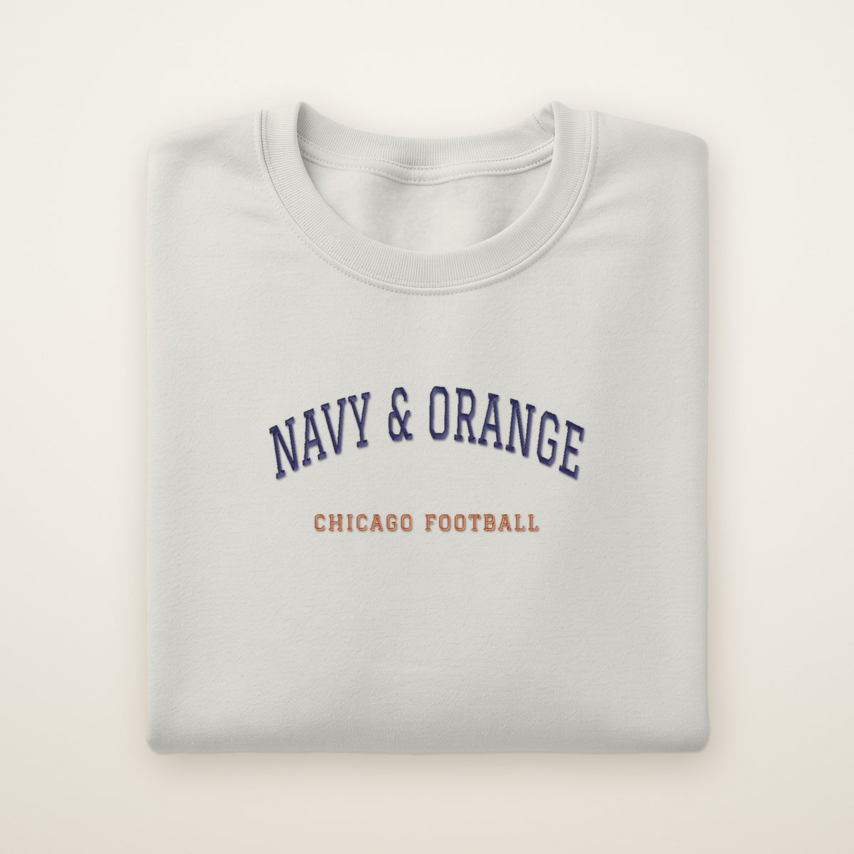 Chicago Football Embroidered Crewneck — Navy & Orange in Ash, flat lay