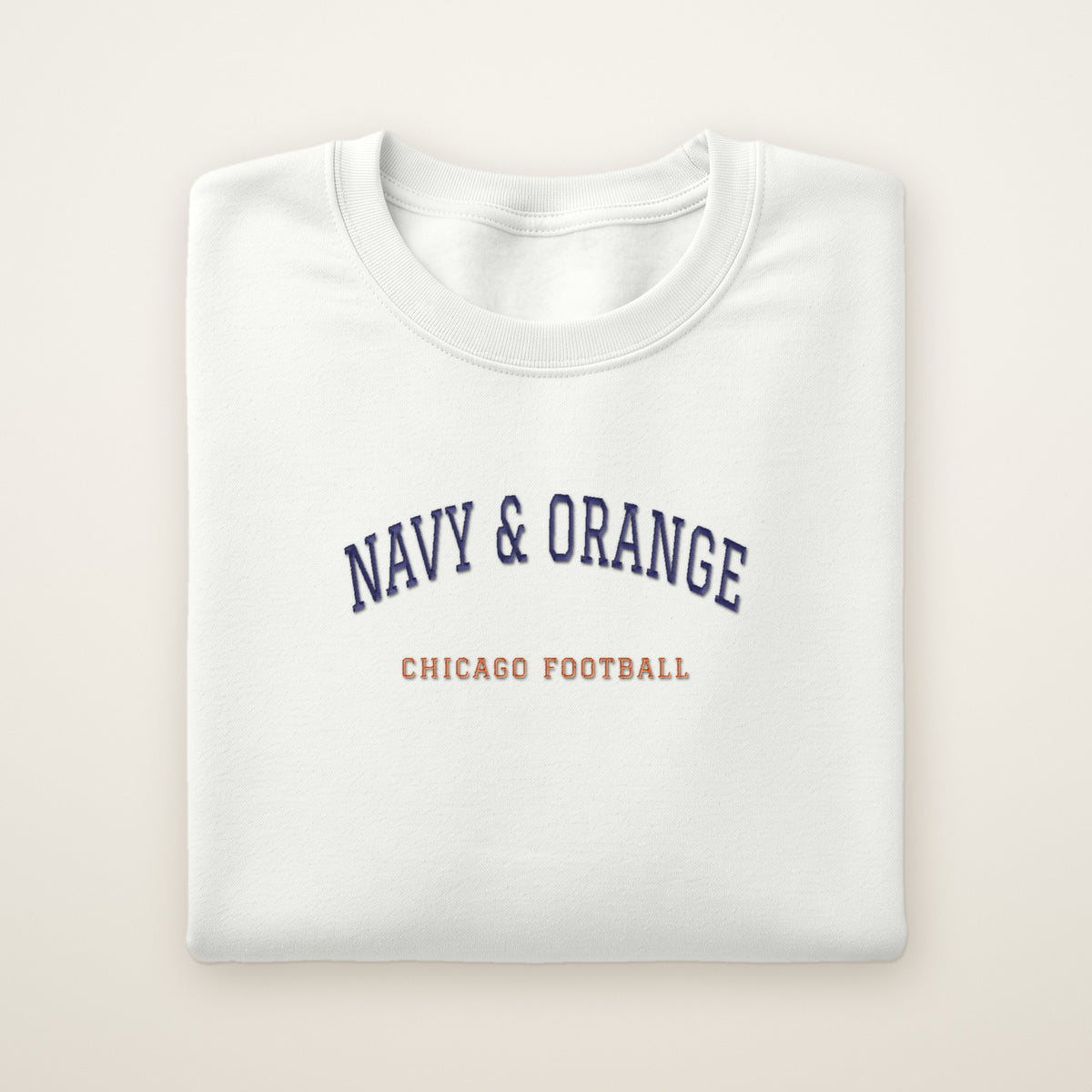 Chicago Football Embroidered Crewneck — Navy & Orange in White, flat lay