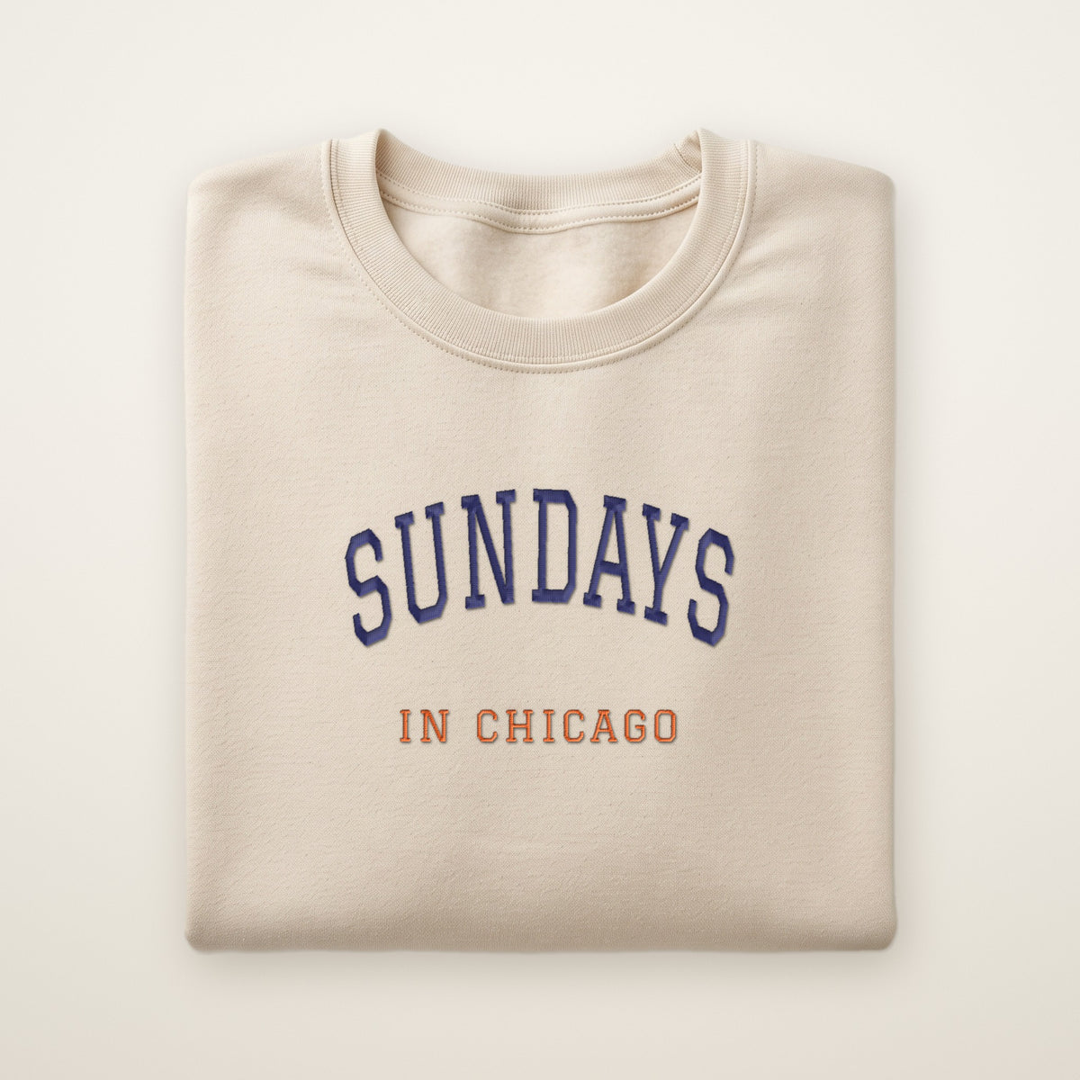 Chicago Football Embroidered Crewneck — Sundays in Chicago in Sand, flat lay