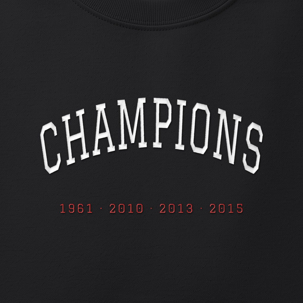 Close-up of the white & red satin-stitch Champions embroidery