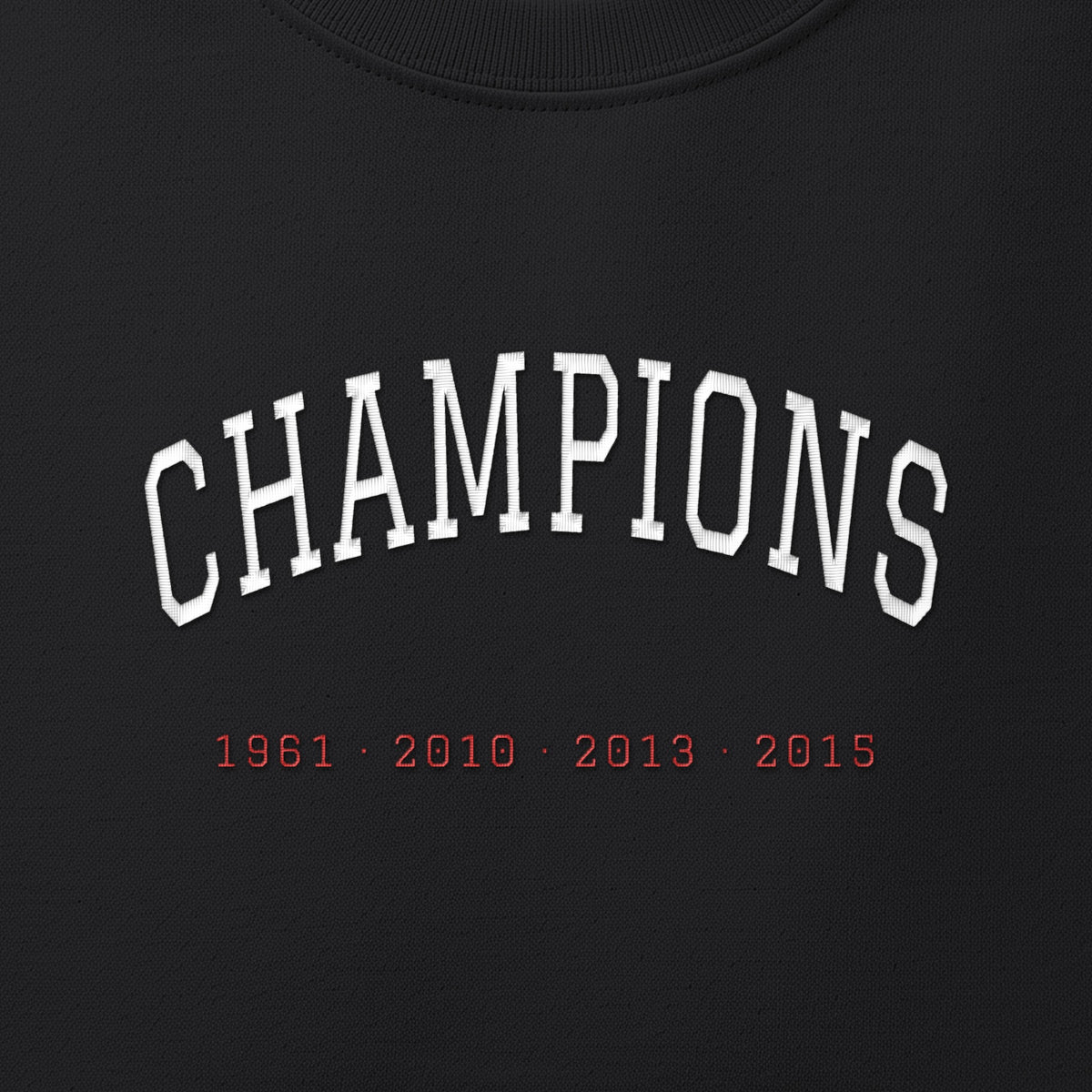 Close-up of the white & red satin-stitch Champions embroidery