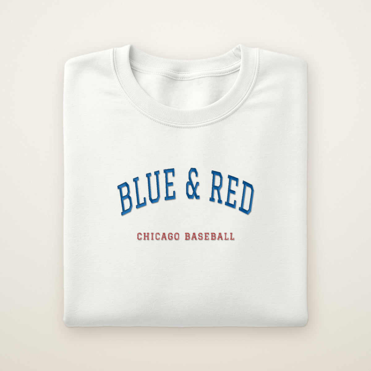 Chicago North Side Baseball Embroidered Crewneck — Blue & Red in White, flat lay