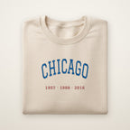 Chicago North Side Baseball Embroidered Crewneck — Title Years in Sand, flat lay