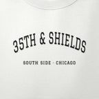 Close-up of the black satin-stitch 35th & Shields embroidery