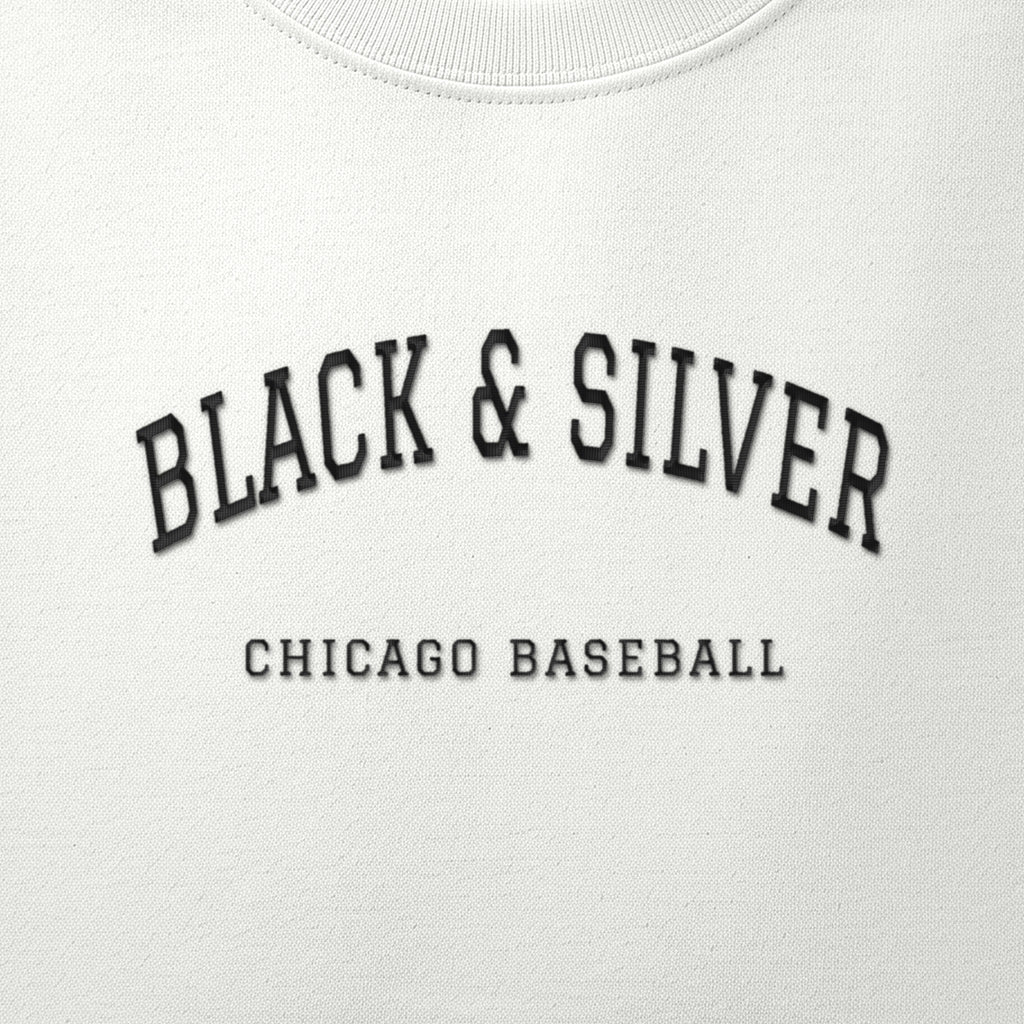Close-up of the black satin-stitch Black & Silver embroidery