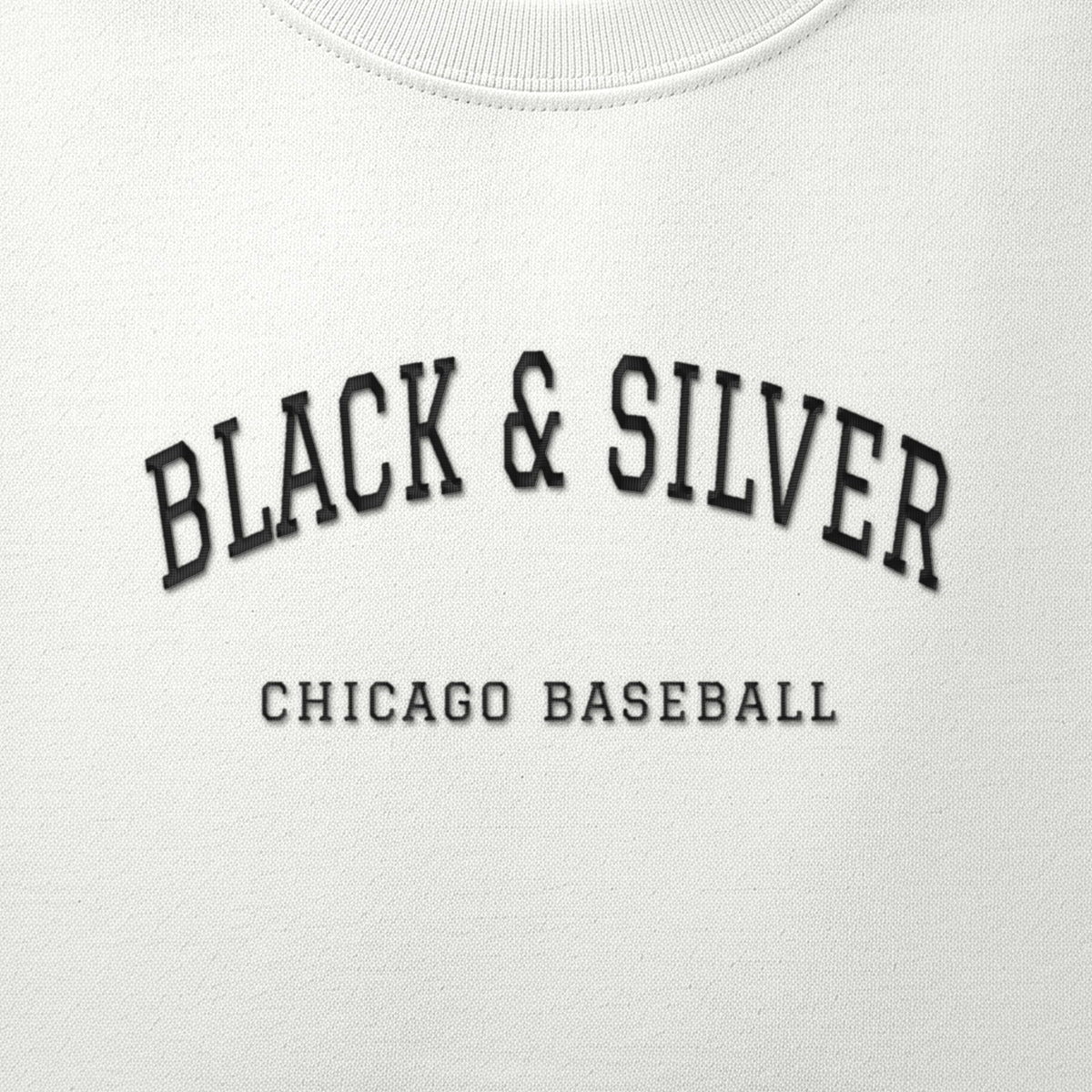 Close-up of the black satin-stitch Black & Silver embroidery