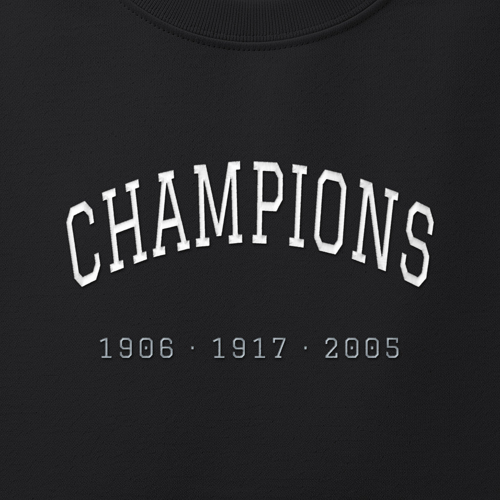 Close-up of the white & silver grey satin-stitch Champions embroidery