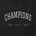 Close-up of the white & silver grey satin-stitch Champions embroidery