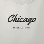 Close-up of the black satin-stitch Chicago Script embroidery
