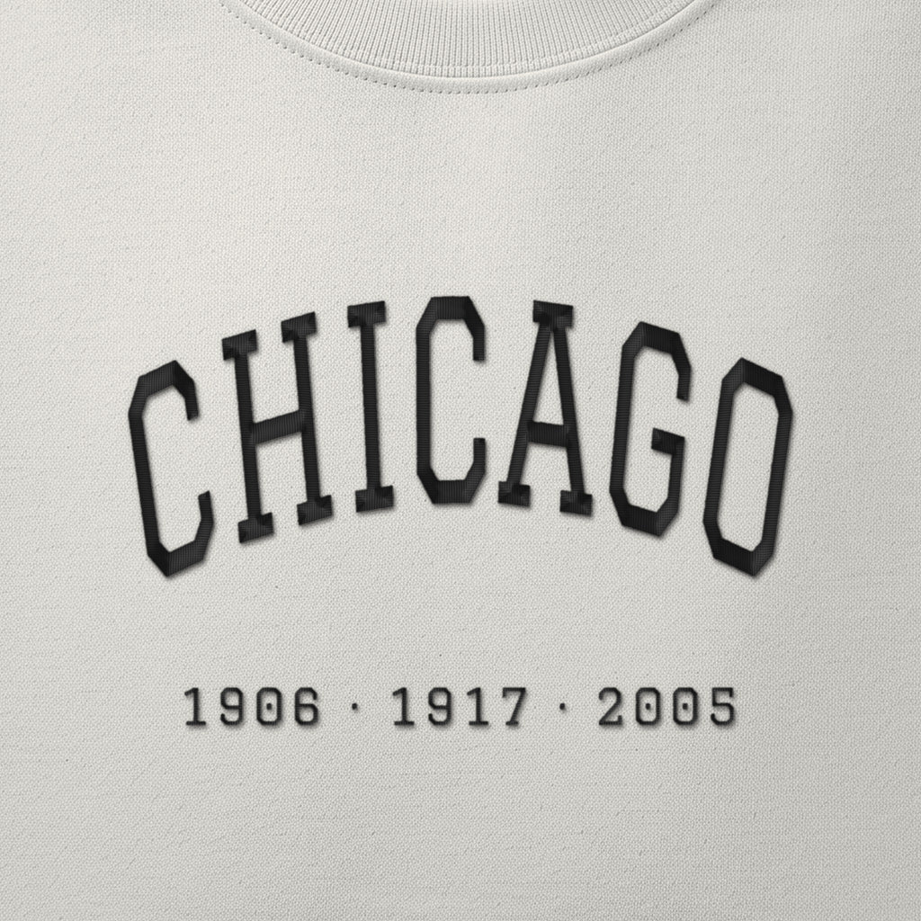 Close-up of the black satin-stitch Title Years embroidery