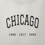 Close-up of the black satin-stitch Title Years embroidery
