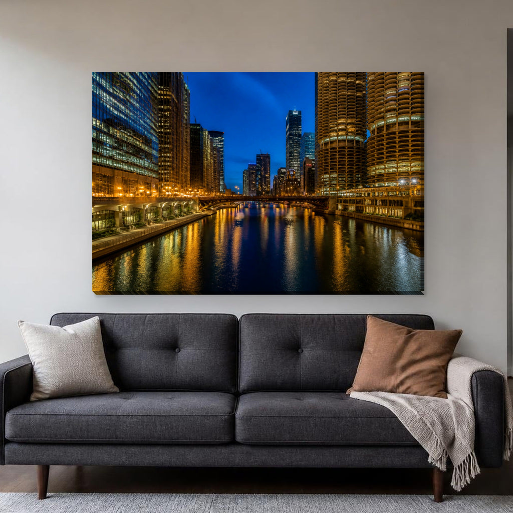 Chicago Riverwalk Canvas Wall Art | River Lights at Night canvas hanging above a charcoal sofa in a living room