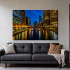 Chicago Riverwalk Canvas Wall Art | River Lights at Night canvas hanging above a charcoal sofa in a living room