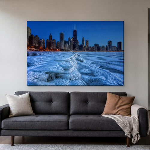 Frozen Lake Michigan Canvas Wall Art | Chicago Skyline in January canvas hanging above a charcoal sofa in a living room