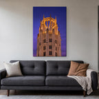 Tribune Tower Canvas Wall Art | Gothic Crown at Dusk canvas hanging above a charcoal sofa in a living room