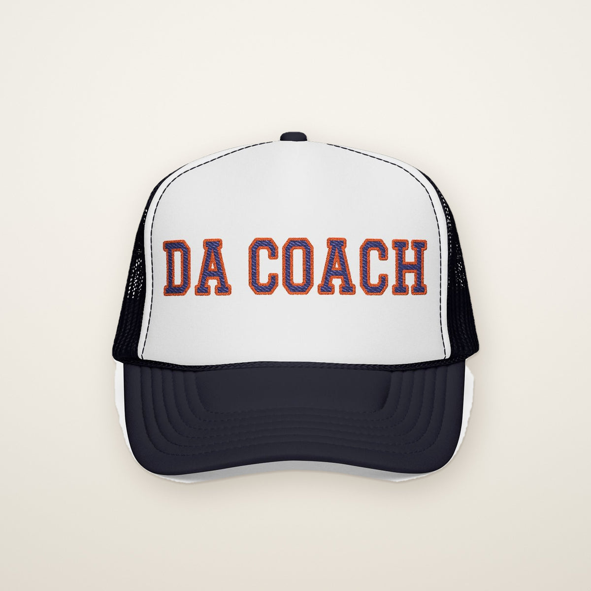 "Da Coach" Embroidered Trucker Hat in Navy / White / Navy, front view on ivory