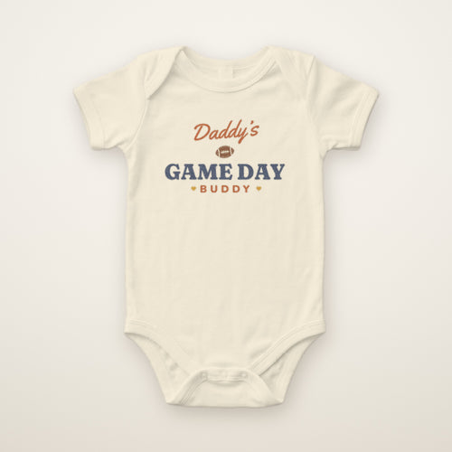 Daddy's Game Day Buddy Bodysuit in Natural, flat lay on ivory