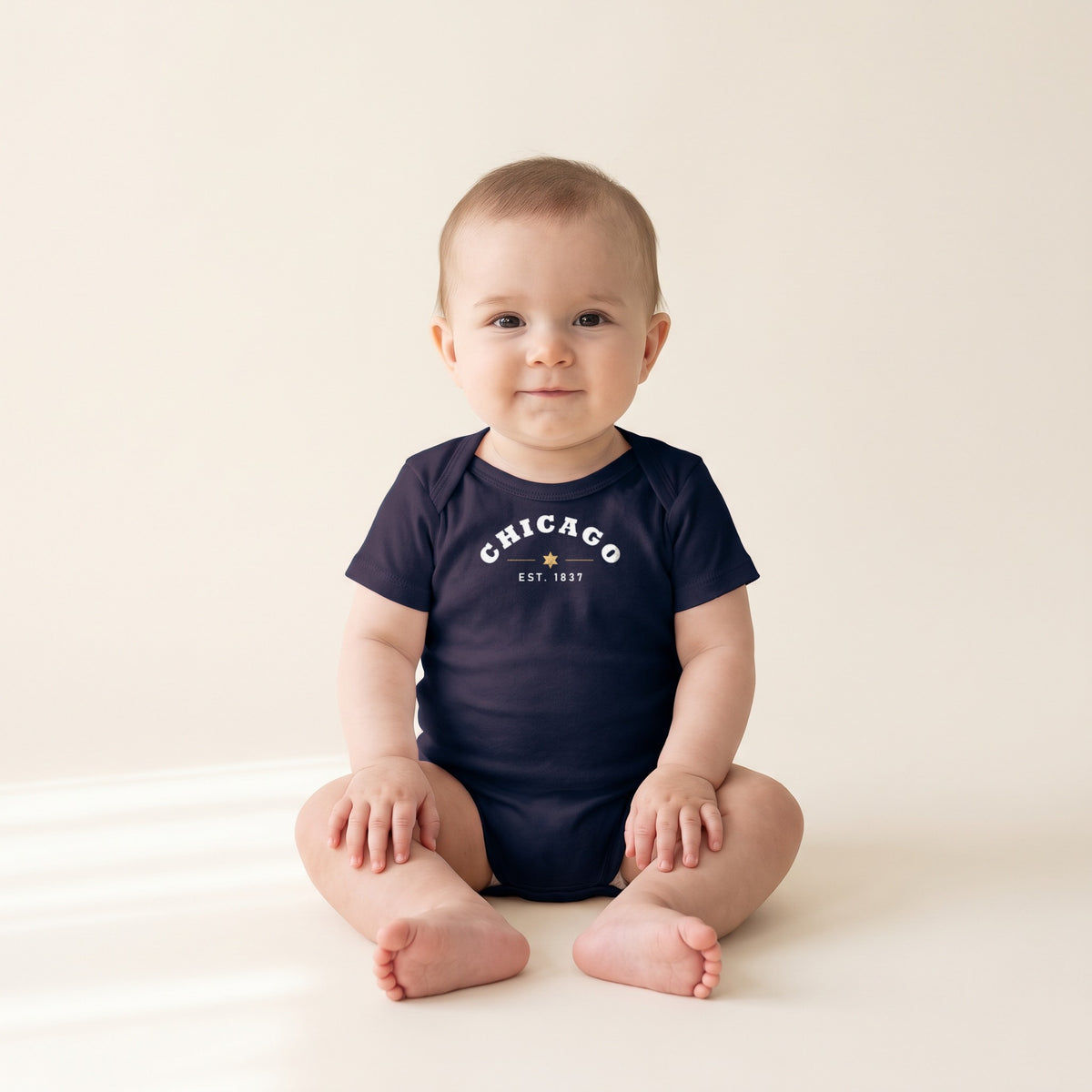 Baby wearing the Chicago Est. 1837 Baby Bodysuit in Navy