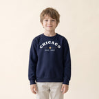 Child wearing the Chicago Est. 1837 Youth Crewneck in Navy