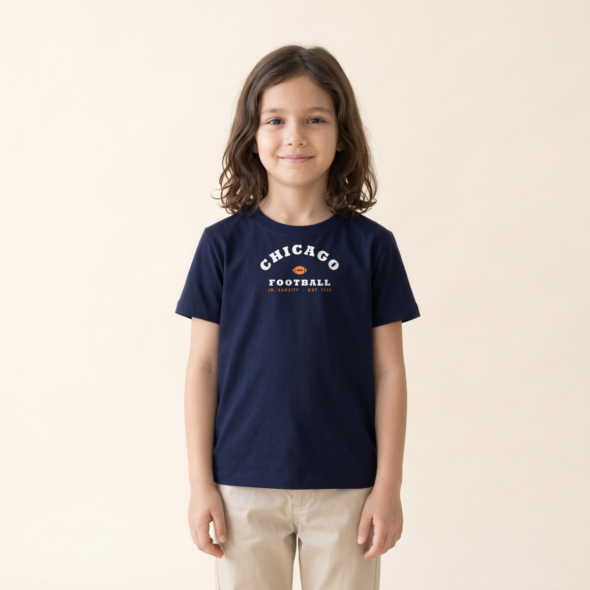 Child wearing the Chicago Football Jr. Varsity Youth Tee in Navy