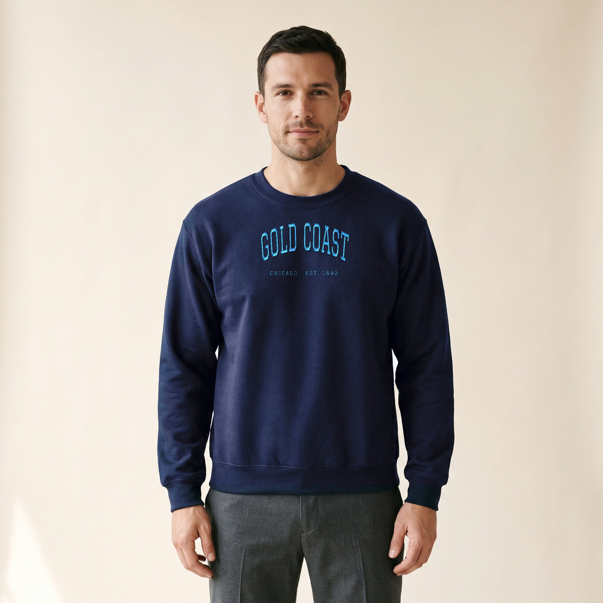 Model wearing the Gold Coast Chicago Embroidered Crewneck — Sky Blue Thread in Navy