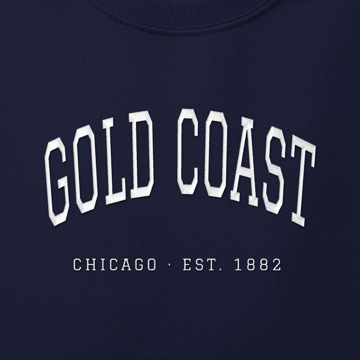 Close-up of white satin-stitch Gold Coast embroidery