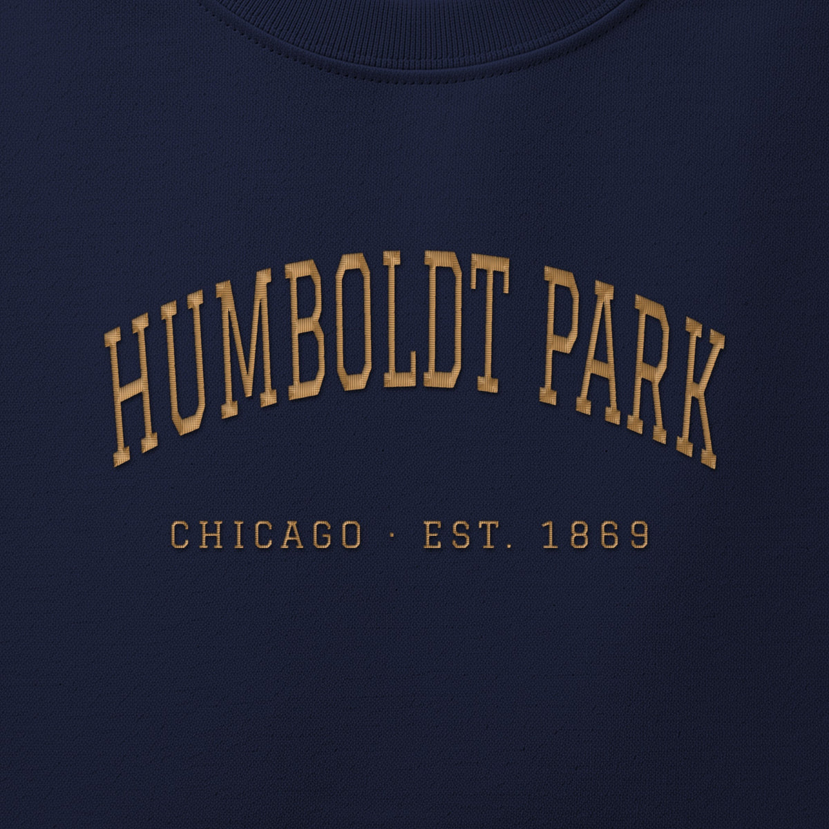 Close-up of gold satin-stitch Humboldt Park embroidery