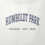 Close-up of navy satin-stitch Humboldt Park embroidery
