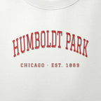 Close-up of red satin-stitch Humboldt Park embroidery