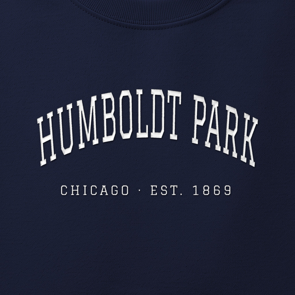 Close-up of white satin-stitch Humboldt Park embroidery