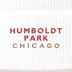 Humboldt Park Chicago embroidery close-up in red and old gold thread