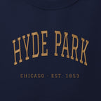 Close-up of gold satin-stitch Hyde Park embroidery