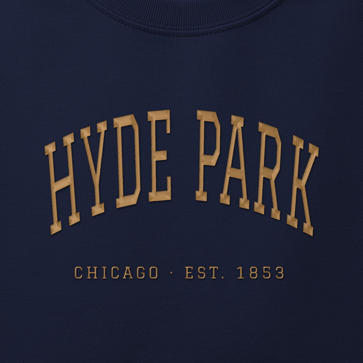 Close-up of gold satin-stitch Hyde Park embroidery