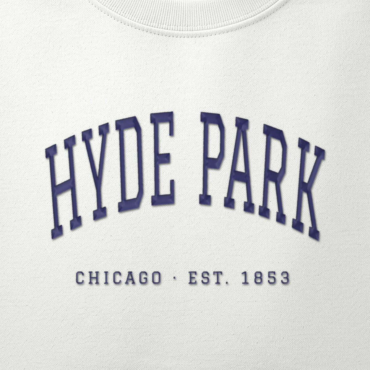 Close-up of navy satin-stitch Hyde Park embroidery