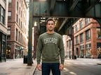 Chicago embroidered crewneck worn under the L tracks in Chicago