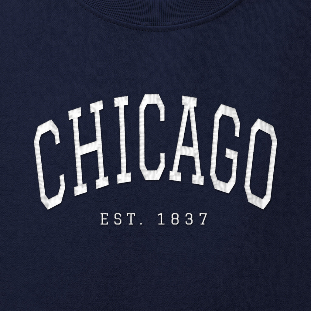 Close-up of white satin-stitch Chicago embroidery