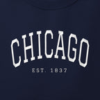 Close-up of white satin-stitch Chicago embroidery
