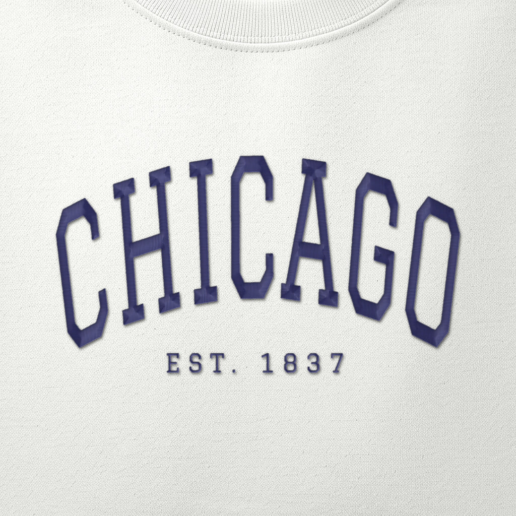 Close-up of navy satin-stitch Chicago embroidery