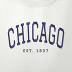 Close-up of navy satin-stitch Chicago embroidery